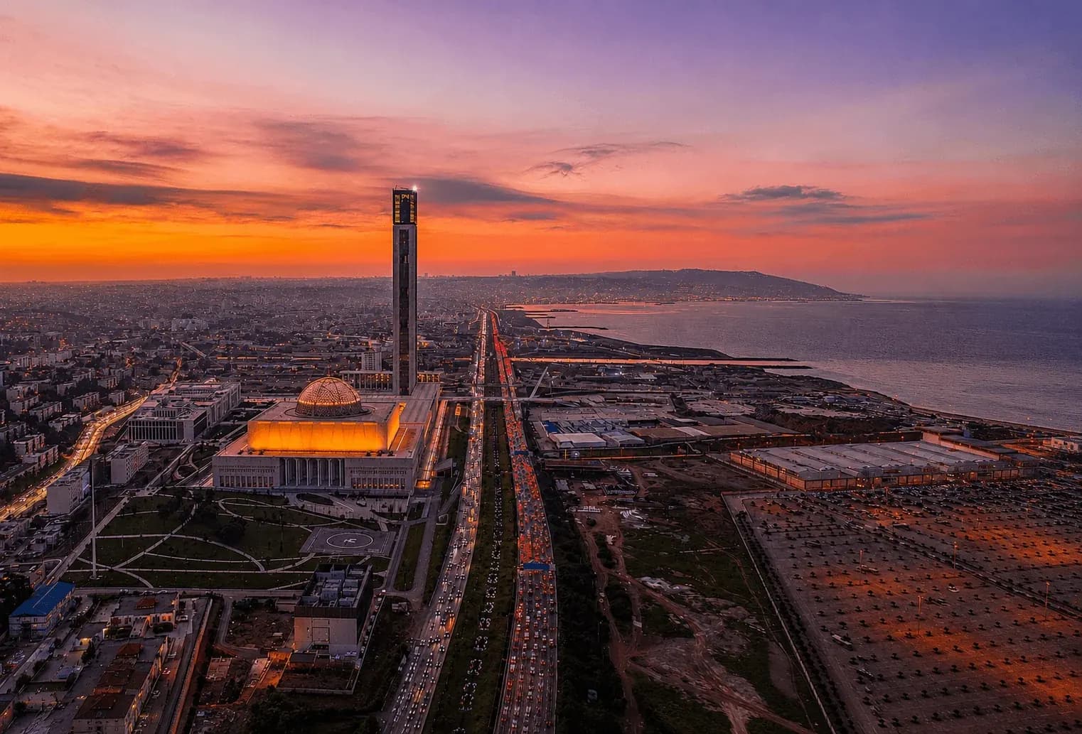 Djamaa El-Djazair, the coastal highway and the bay of Algiers at dusk