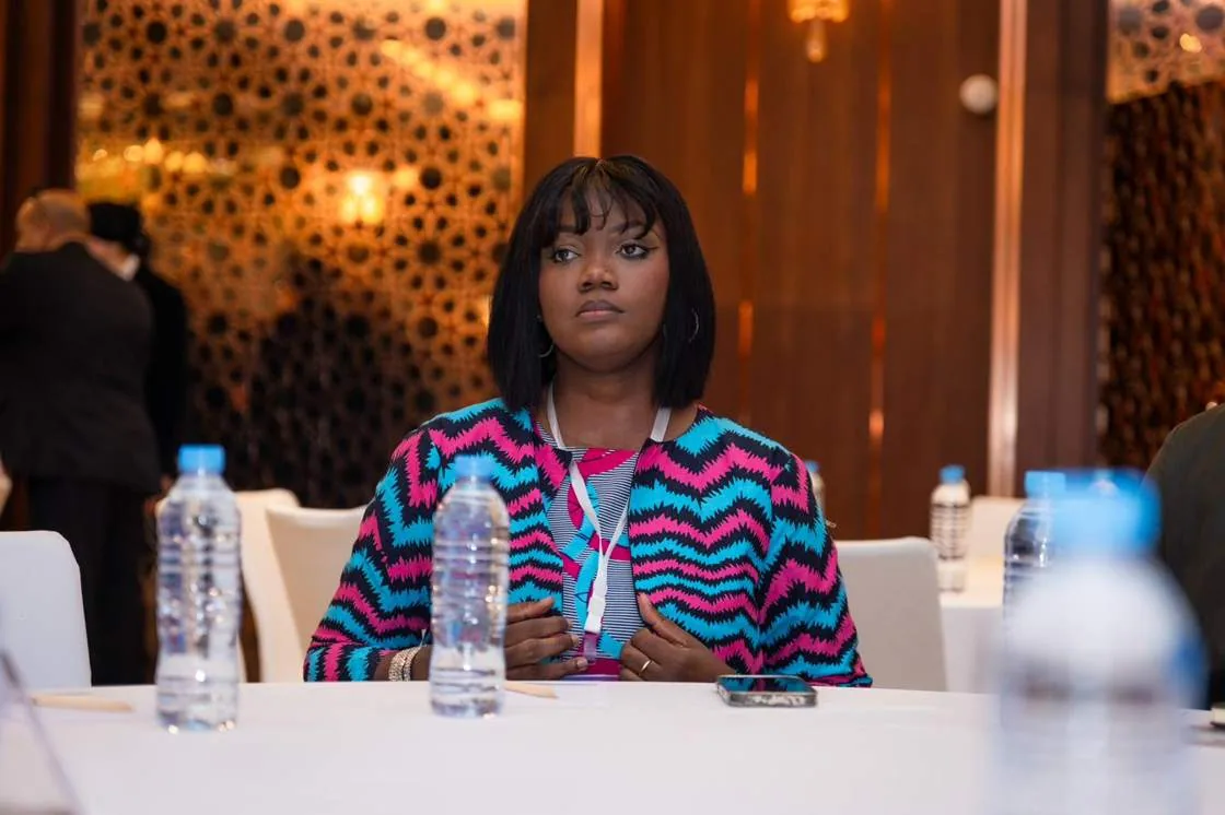 A delegate following a session from the floor