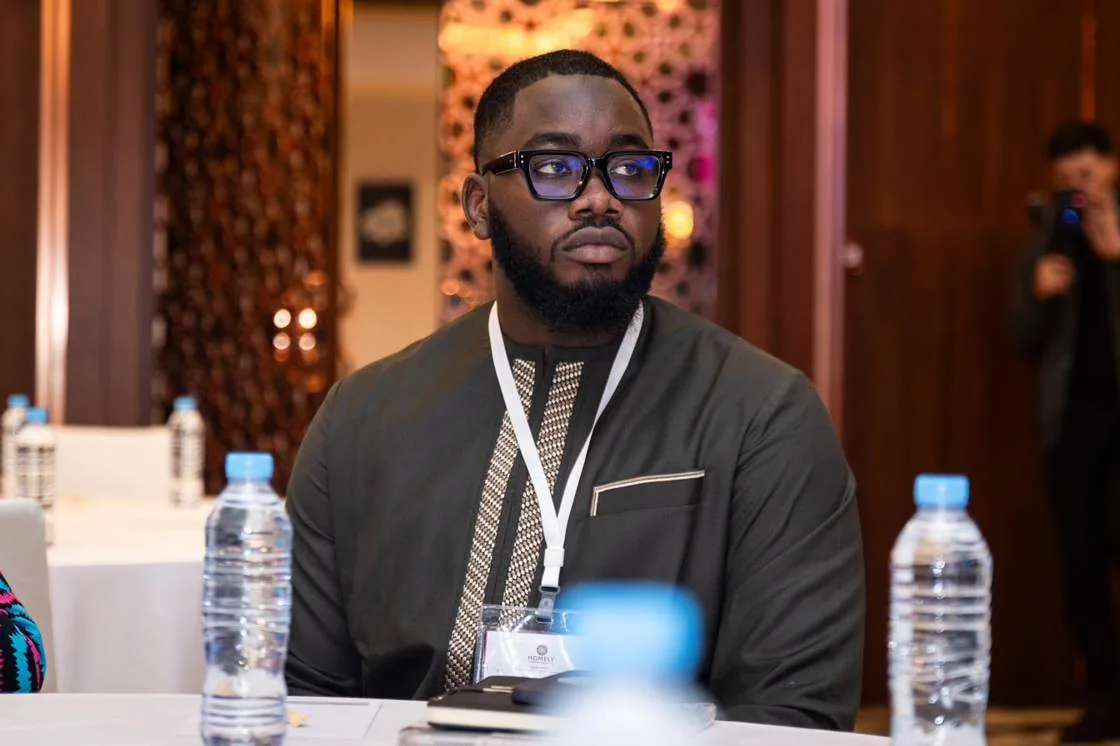 A delegate listening during the investment panel