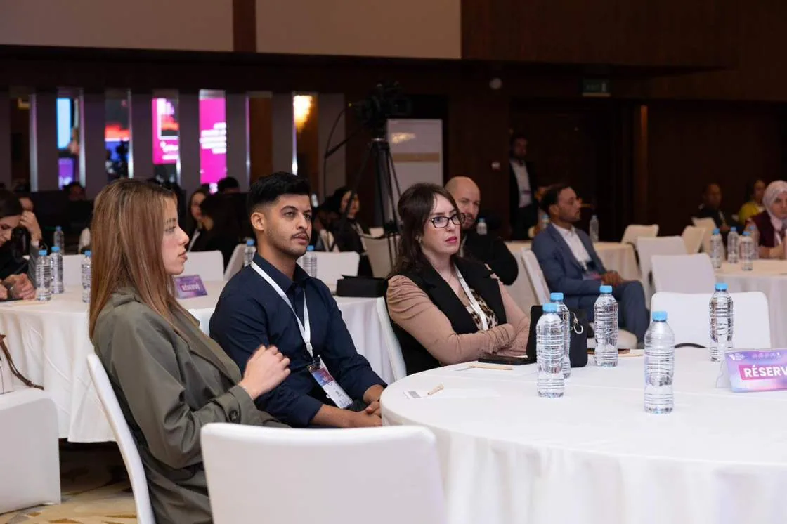 Delegates seated during a conference session