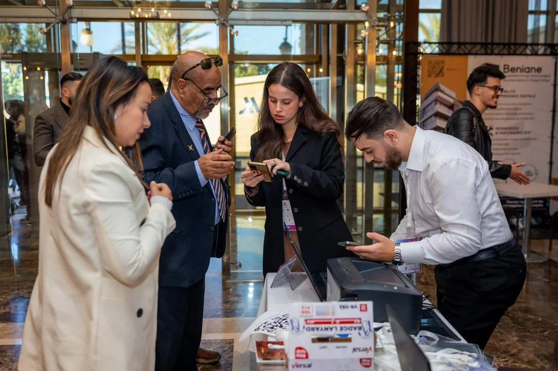 Delegates registering at an exhibitor stand on the ARIIS opening morning