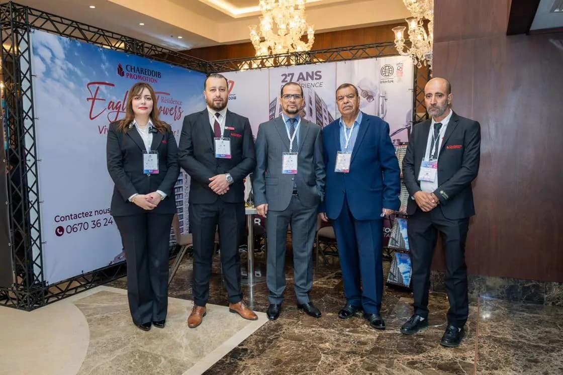 An exhibitor team at their stand during the summit