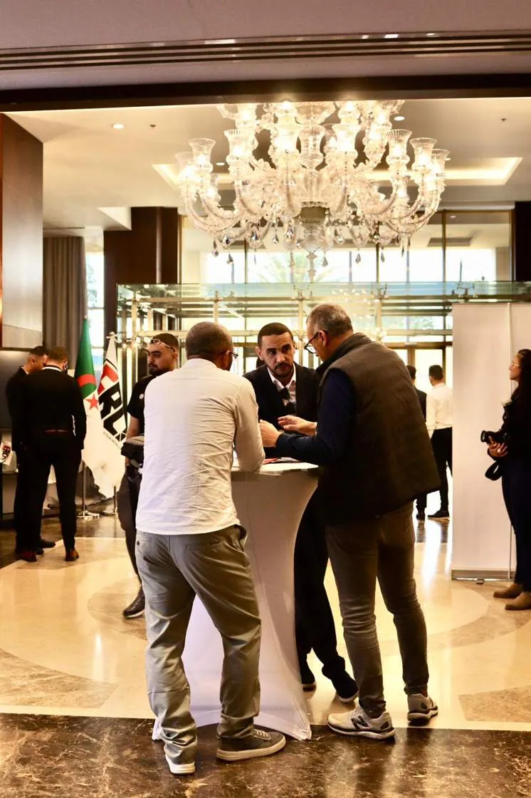 Delegates networking in the summit foyer