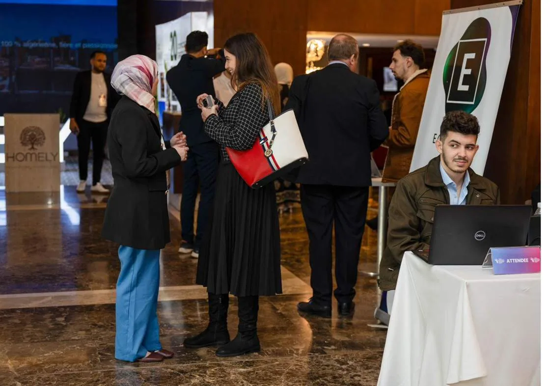 Delegates networking in the exhibition foyer
