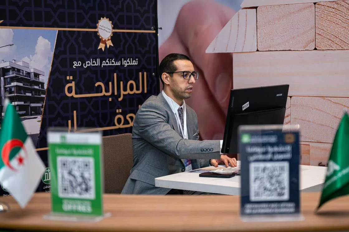 An exhibitor presenting a residential finance offer at the summit
