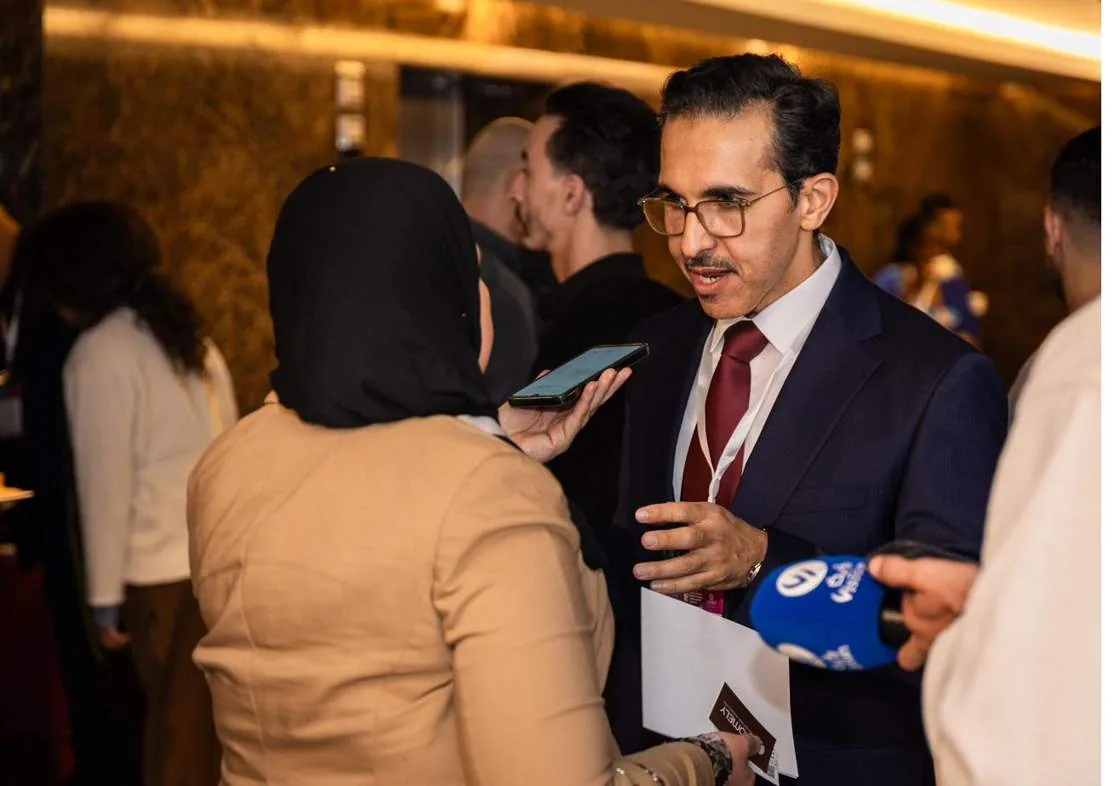 A delegate interviewed by broadcast media at the summit